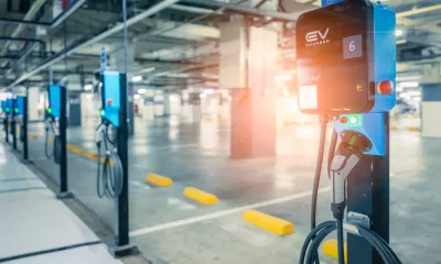Close-up of row of electric car charging stations in a covered garage structure
