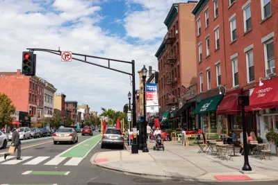 Crosswalk on street with green bike lane in Hoboken, New Jersey.