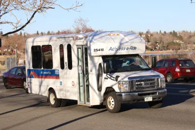White Denver RTD on-demand microtransit van on street.