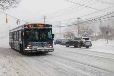 CTtransit bus driving through snowy street in Norwalk, Connecticut