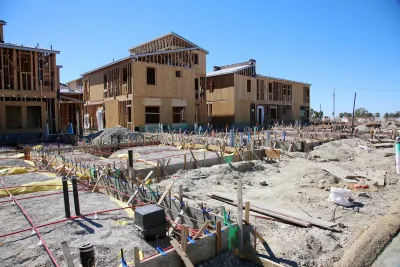 Wood frame multifamily housing under construction.