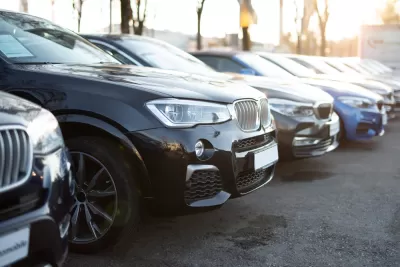 Row of cars in parking lot