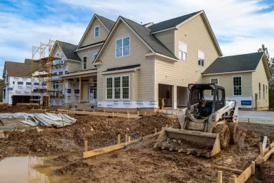 Single-family house with two-car garage under construction