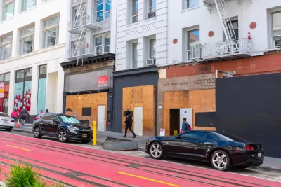 Vacant boarded-up storefronts along Powell Street in San Francisco, California.