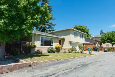 Yellow house on residential street in Atherton, California