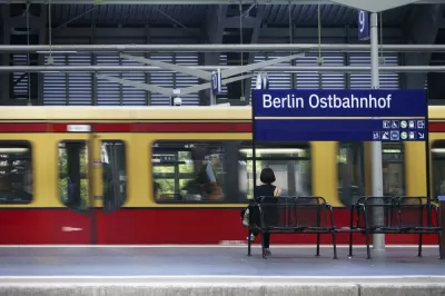 A platform of the Berlin East Railway station with a waiting traveler and a tram on June 17, 2014 in Berlin