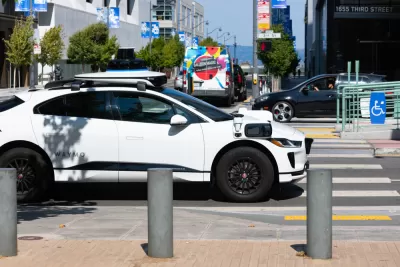 White Waymo self-driving car on San Francisco street