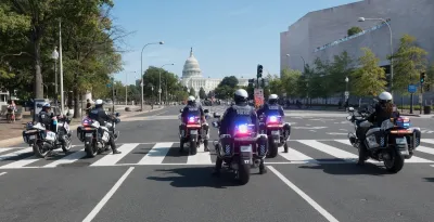 Several Washington DC police on motorcycles with capitol dome in background.