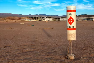 "No Boats" sign on dry Lake Mead bed 