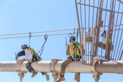 Worker performing maintenance work on the Brooklyn Bridge, New York City