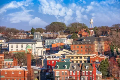Dense historic neighbrohood with colorful multistory buildings in Richmond, Virginia at golden hour.