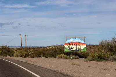 Dry stretch of road with Presidio sign.