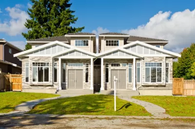 Duplex with twin two-story homes