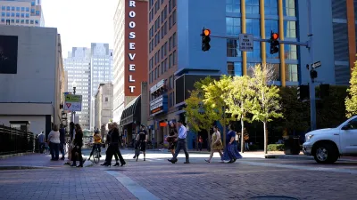 People cross the street in downtown Pittsburg. 