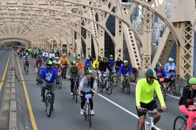 People biking across the Queensboro Bridge
