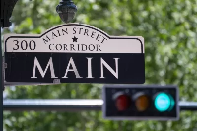 Main Street Sign with Traffic Light in the Background in Downtown Houston, Texas
