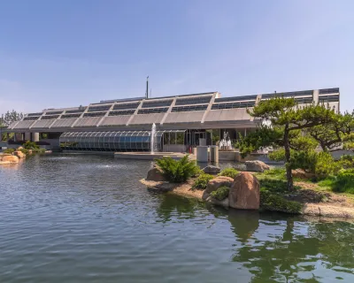 Tillman water reclamation facility in Van Nuys, California with Japanese garden surrounding glass modernist building.