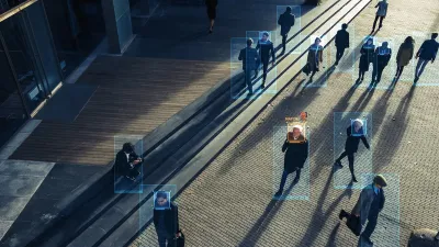 Image from CCTV camera with boxes around peope identifying human shapes.