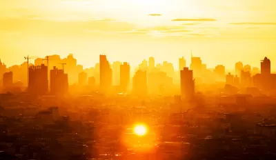 View of buildings in Bangkok business district through extremely orange sunlight