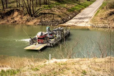 Small ferry carrying two cars across small river in Mammoth Cave National Park, Kentucky.