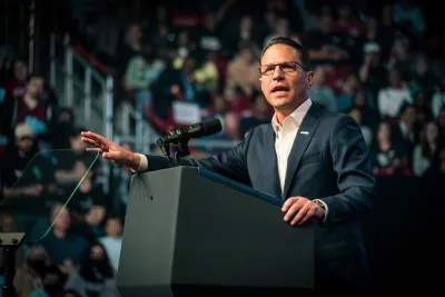 Pennsylvania GOvernor Josh Shapiro speaking at a podium.