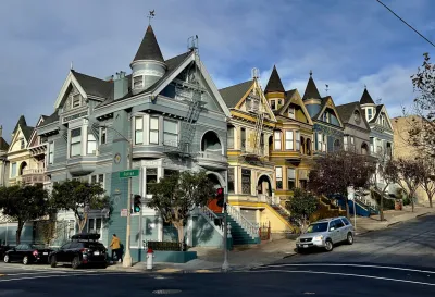 Ornate Victorian homes with turrets and rounded windows in San Francisco, California.