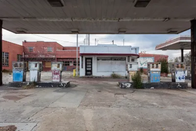 Abandoned, boarded up small vintage gas station in rural Georgia.