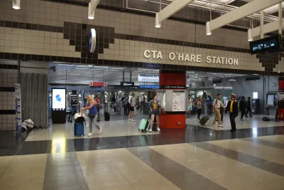 Chicago O'Hare transit station with people walking.