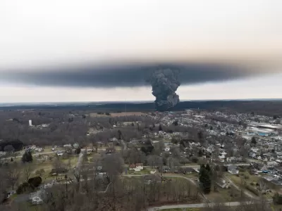Gray chemical cloud seen from a distance from train derailment in Palestine, Ohio