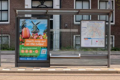 Bus stop with shelter and advertising panel in Amsterdam, Netherlands.