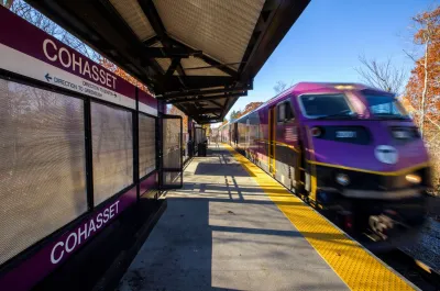 Purple MBTA train at station in Cohasset Station, Massachusetts.