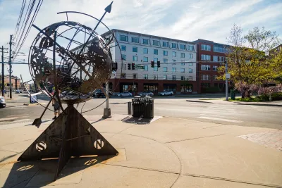 Plaza in Portland, Maine with statue of globe with compass rose.