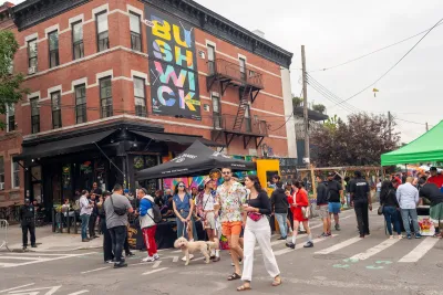 People walking around at a street fair in Bushwick, New York City.