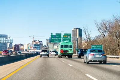 A busy highway in Richmond, with construction and the city visible in the background.
