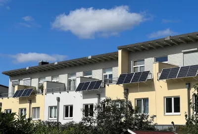 Solar panels installed on balconies on multi-family building.