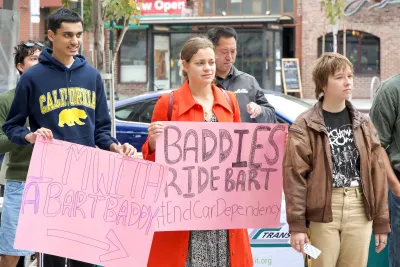 Participants listening to speakers at a Transit Rally outside the Downtown Berkeley BART station.