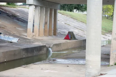 Tent pitched under freeway overpass in Houston, Texas.