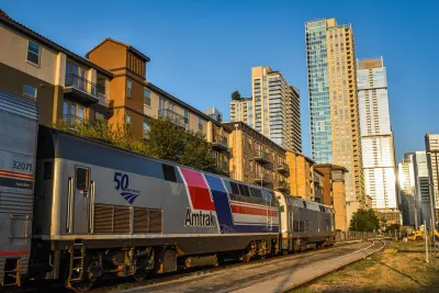 Amtrak train with Austin high-rises in the background.