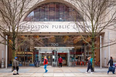 Facade of Boston Public Library branch with title etched in stone above doorway.