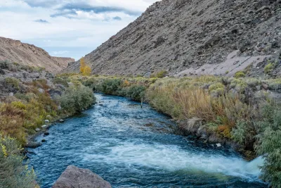 Owens Owens River in Bishop, California with water spilling in from Pleasant Valley Dam.