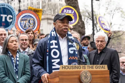 New York City Mayor Eric Adams speaking at an outdoor lectern.