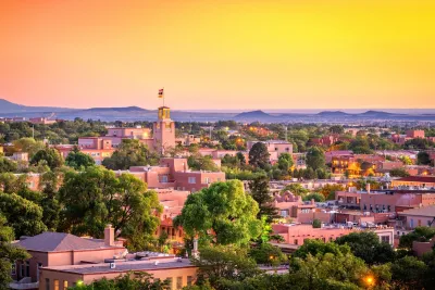 Cityscape of Santa Fe, New Mexico at dusk.
