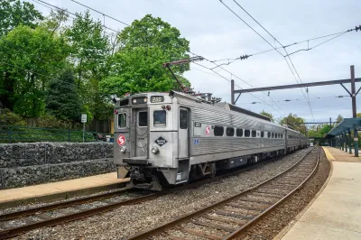 A SEPTA Silverline IV train drives towards the camera.