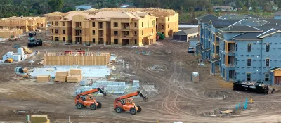 Three-story wood-framed apartment buildings being built in North Port, Florida.