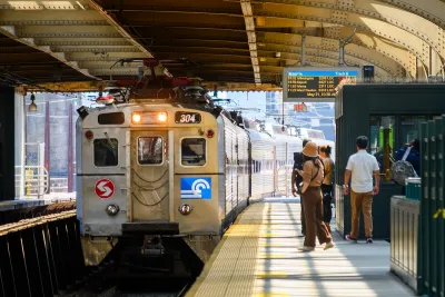 Silver train at outdoor covered platform in Philadelphia, Pennsylvania.
