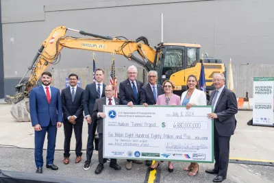 Elected officials pose after conclusion of celebration for full funding for Hudson Tunnel Project at construction site in New York on July 8, 2024.