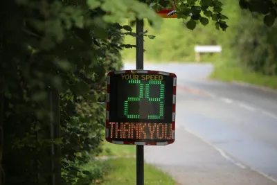 Electronic sign on roadside with 29 in green and Thank You in yellow below it.