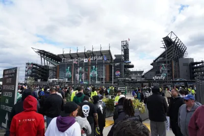Crowd of fans in front of Philadelphia's Lincoln Field stadium.