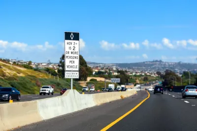 Sign for HOV lane for carpools 2+ on California freeway.