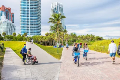 People bike and jog through a park in Florida.
